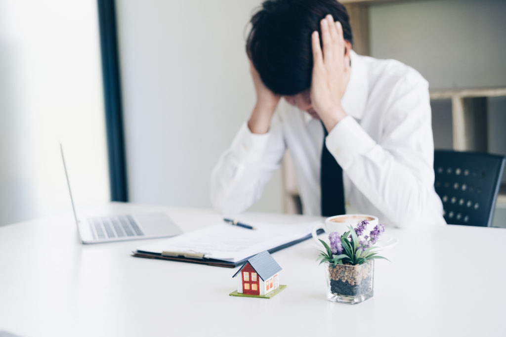 Frustrated business man stress when fail with real estate agent