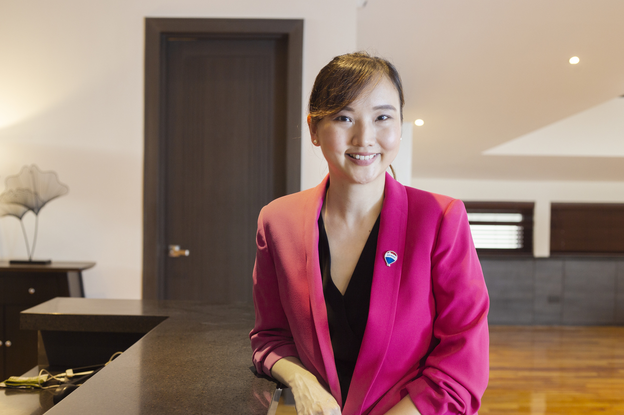 daphne yu wearing a pink blazer