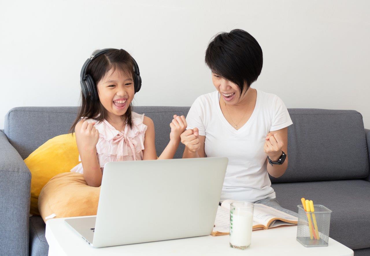 mother and daughter on a laptop