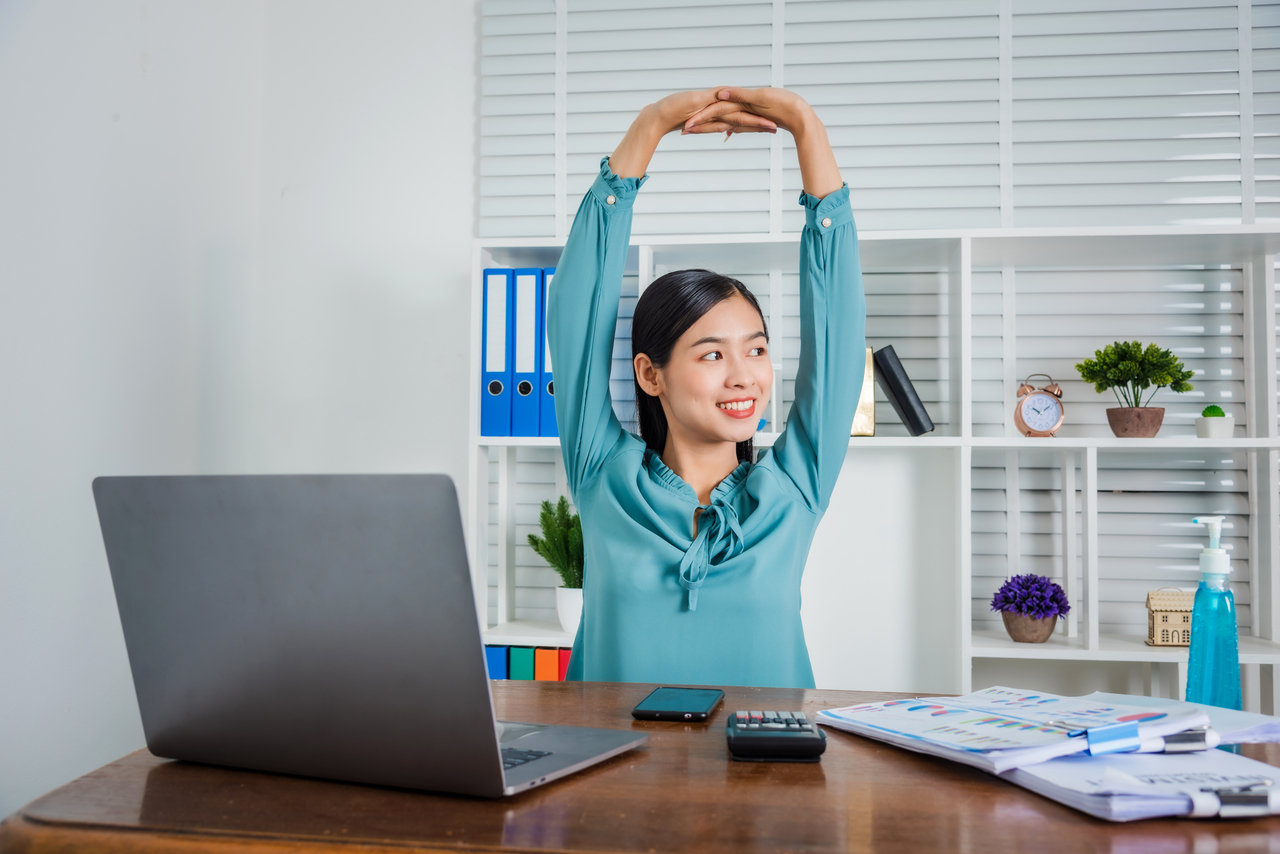 A woman with an organized office space at home