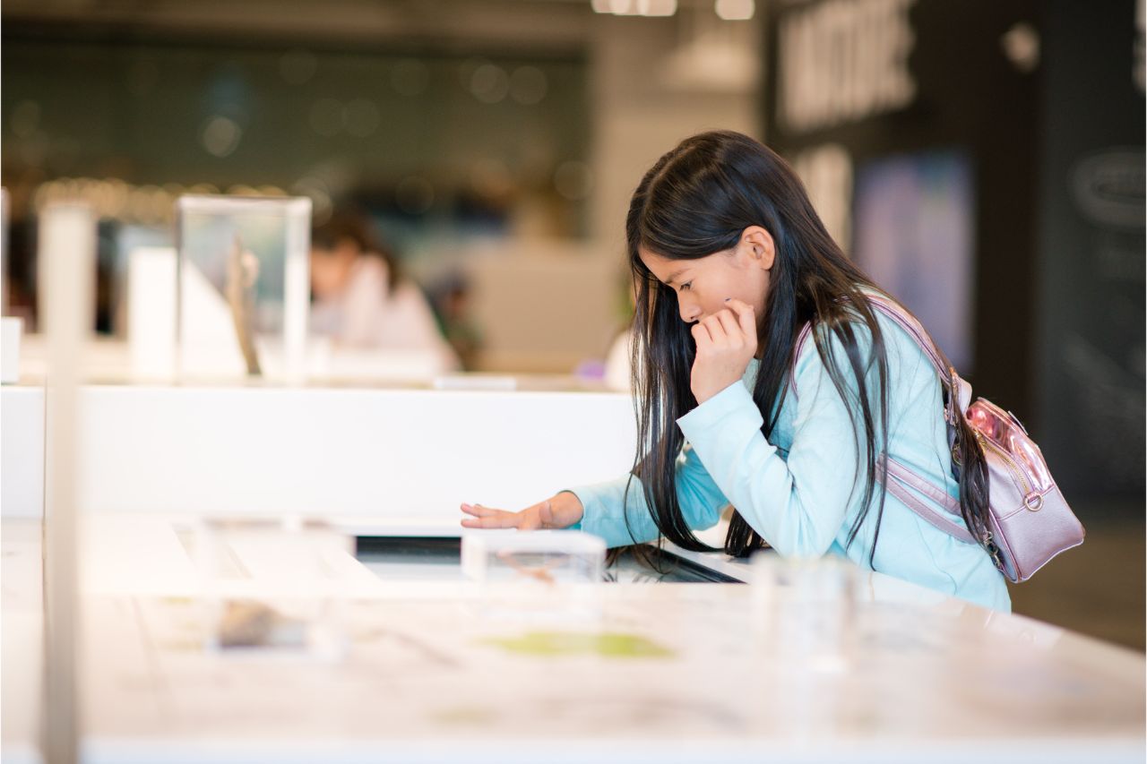 Young girl exploring a science museum