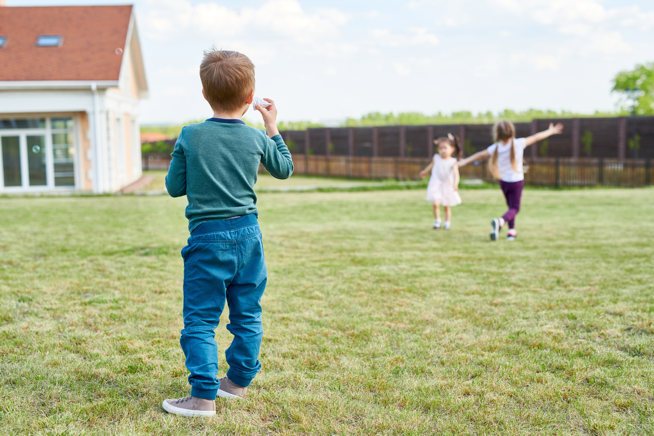 Group of Children Playing in Front Yard