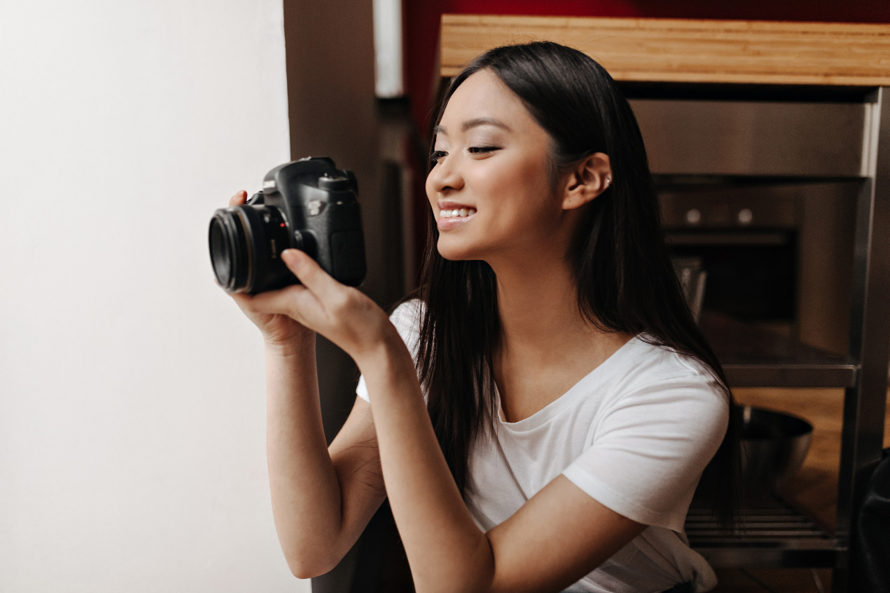 nice woman white top is smiling taking pictures front 1