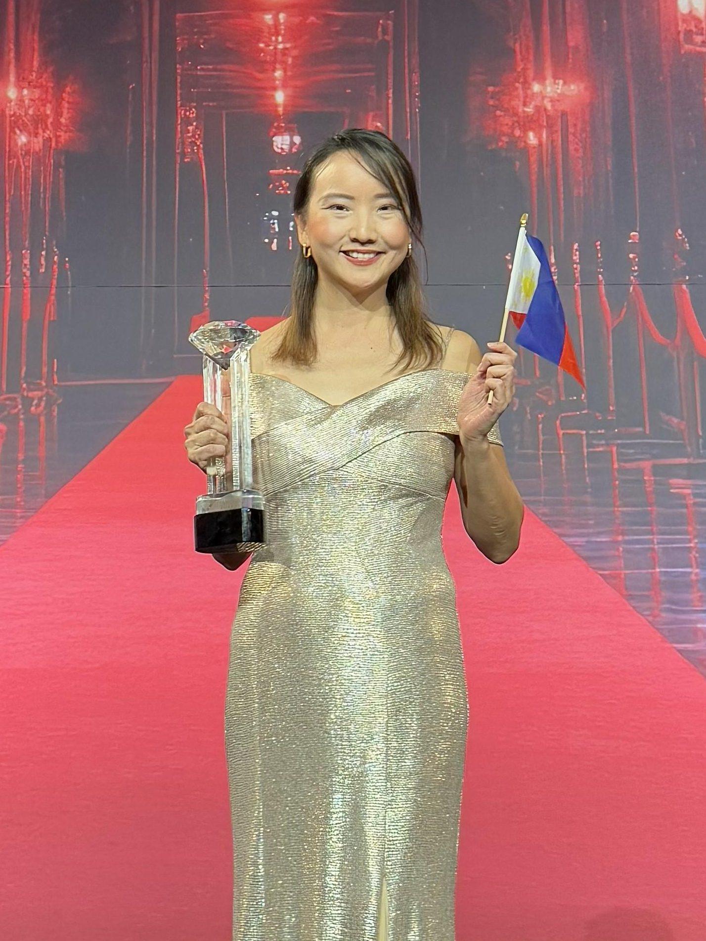 About 6 Daphne Yu receiving her Diamond Club Award on stage Feb 2025 in Las Vegas edited 1