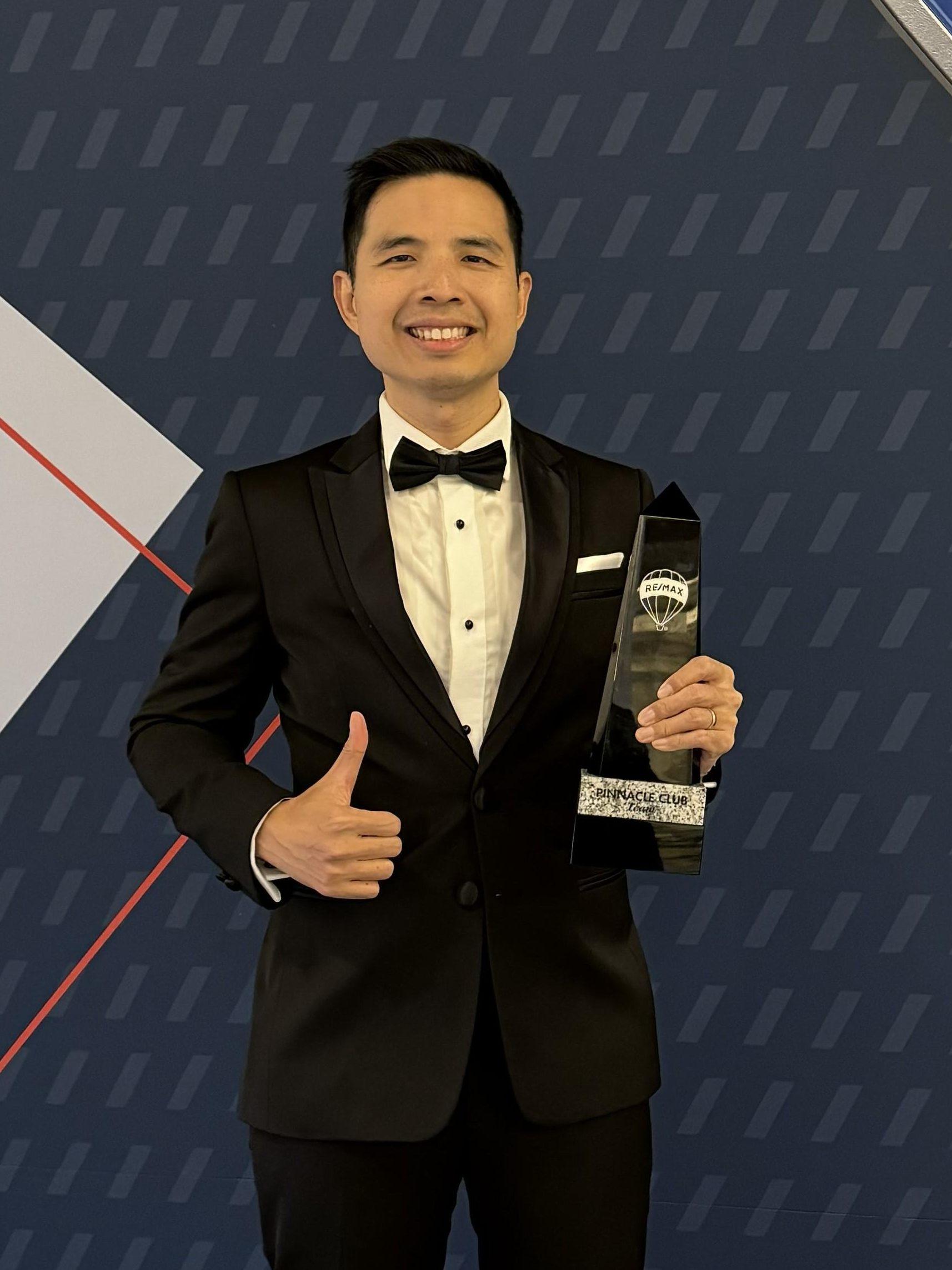 About 9 John Yu receiving the Pinnacle Club Team Award Feb 2024 in Las Vegas edited 1