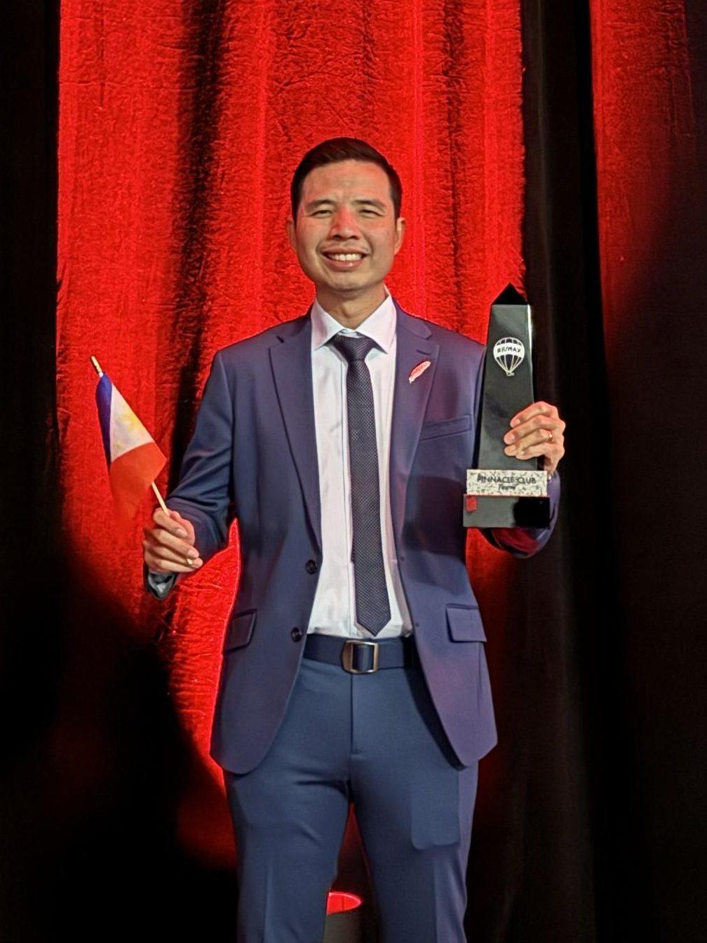 About 10 John Yu receiving the Pinnacle Club Team Award Feb 2025 in Las Vegas edited 2